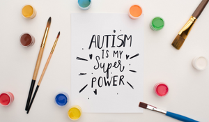 Painted on a sheet of paper "Autism is my super power" 