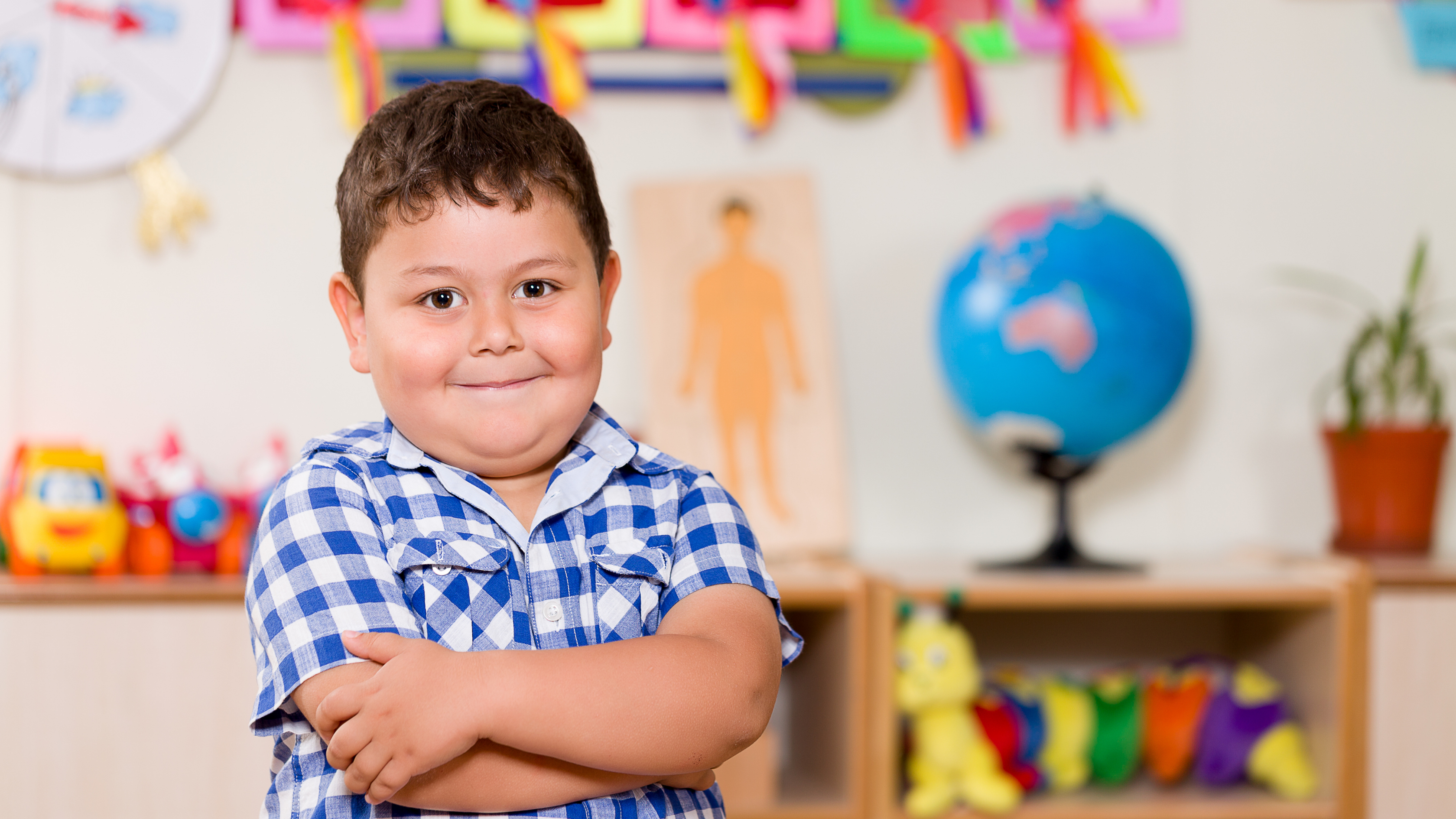 boy with plaid shirt in learning room